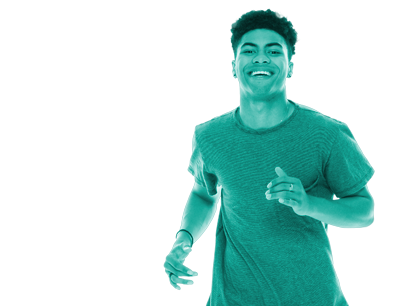 mixed race young man smiling whilst running