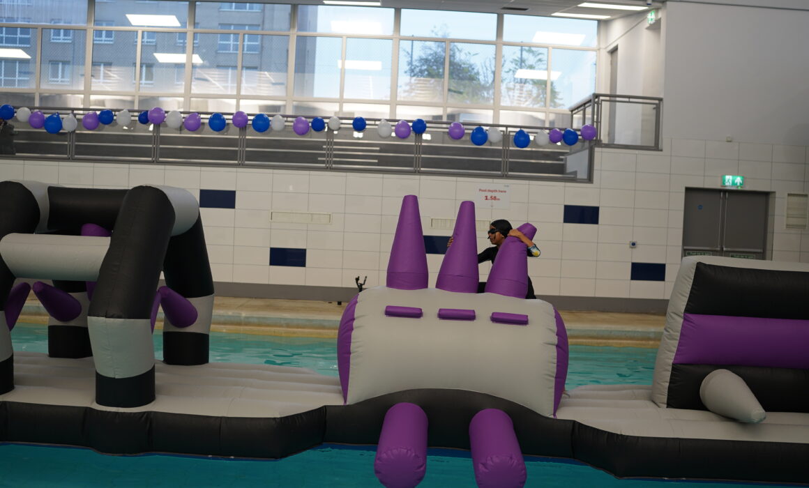 A photo of a young girl on a pool inflatable